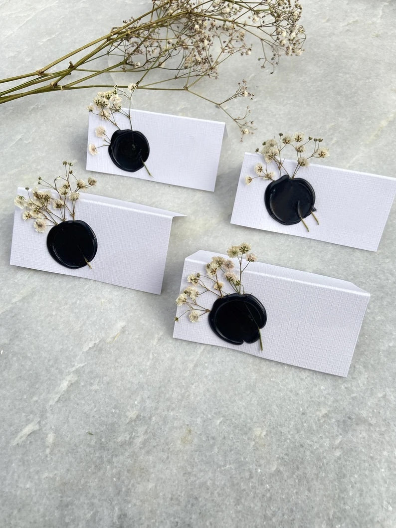 Mono black and white wedding name place cards with Gypsophila